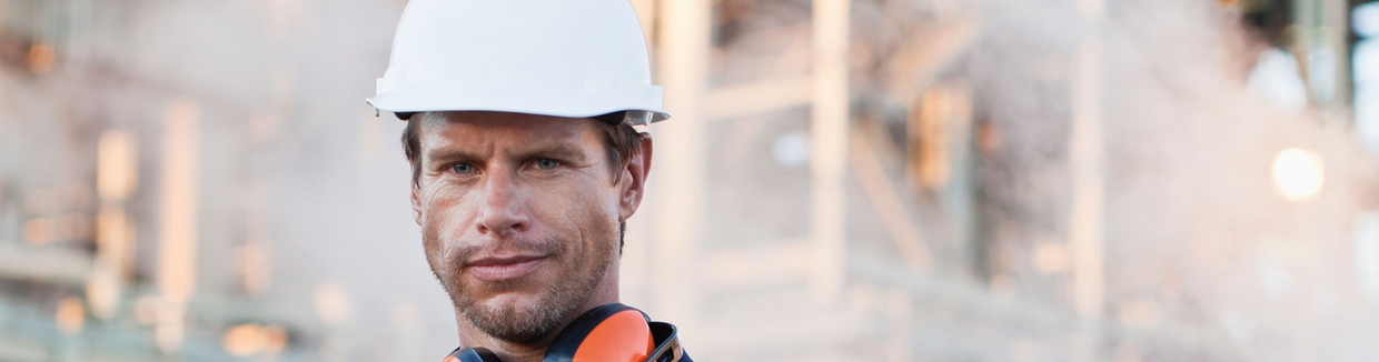 Worker with steam in the background